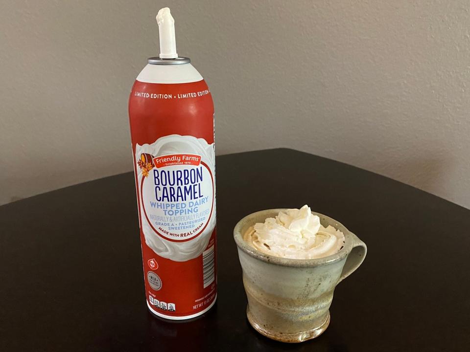 Friendly Farms bourbon-caramel whipped topping and a mug of coffee with whipped topping