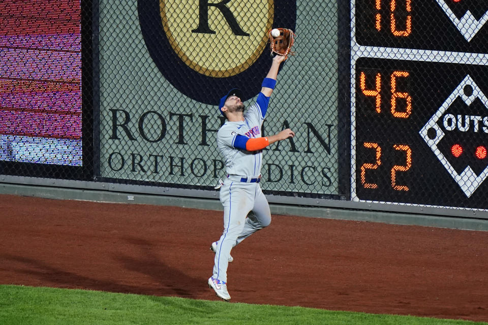 New York Mets right fielder Michael Conforto catches a fly out by Philadelphia Phillies' Roman Quinn during the fourth inning of a baseball game, Tuesday, Sept. 15, 2020, in Philadelphia. (AP Photo/Matt Slocum)