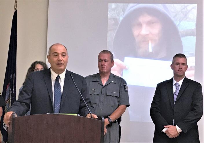 Schuyler County District Attorney Joseph Fazzary, joined by law enforcement officials, makes a plea during a Tuesday, Aug. 17 2021 news conference for public help solving the August 2020 murder of Richard Seeley.