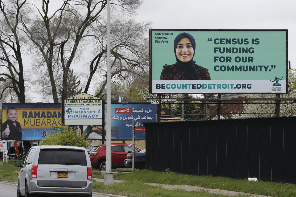 In this Thursday, April 30, 2020 photo, a billboard highlighting the 2020 Census is seen in Dearborn, Mich. The Arab American community checks many boxes that census and nonprofit officials say are hallmarks of the hardest-to-count communities: large numbers of young children, non-English speakers, recent immigrants and those who often live in multifamily or rental housing. (AP Photo/Carlos Osorio)