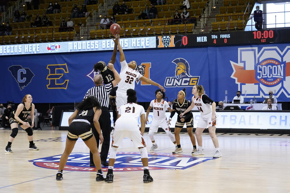 Wofford forward Jamari McDavid (12) and Mercer forward Jaron Dougherty (32) tip off for the start of the NCAA women's college basketball championship game for the Southern Conference tournament, Sunday, March 7, 2021, in Asheville, N.C. (AP Photo/Kathy Kmonicek)