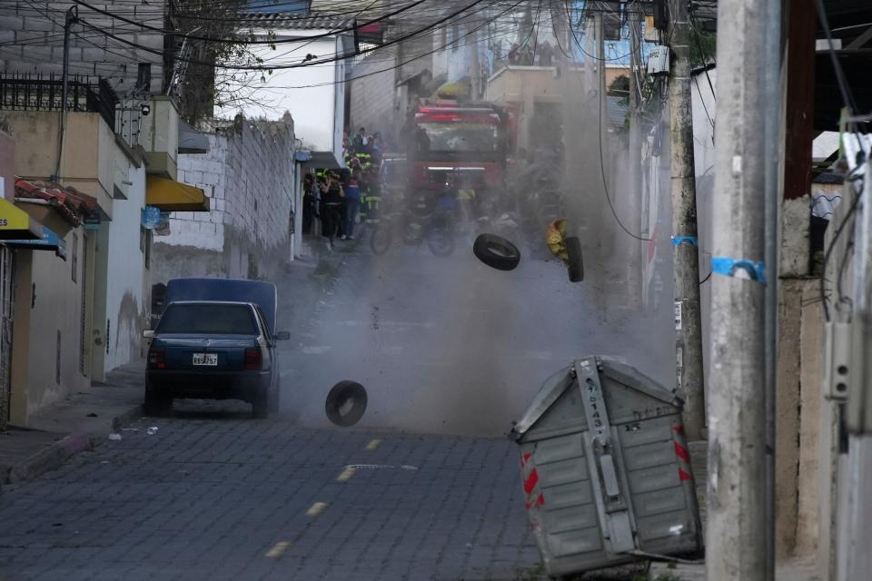 Police carry out a controlled explosion of a suspicious vehicle parked a block from El Inca prison, in Quito, Ecuador, on Jan. 10, 2024.
