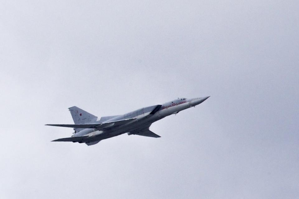 FILE - In this Thursday, May 5, 2016 file photo, a Russian Tu-22M3 bomber flies over Moscow's Kremlin during a general rehearsal for the Victory Day military parade which will take place at Moscow's Red Square on May 9 to celebrate 71 years after the victory in WWII in Moscow, Russia. The Russian military said Tuesday May 25, 2021, it has deployed three nuclear-capable long-range Tu-22M3 bombers to its base in Syria, a move that would strengthen Moscow's military foothold in the Mediterranean. (AP Photo/Ivan Sekretarev, File)