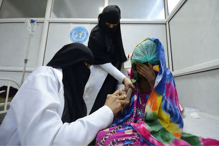 Nurses attend to Saida Ahmad Baghili, 18, at the al-Thawra hospital where she receives treatment for severe acute malnutrition in the Red Sea port city of Houdieda, Yemen October 25, 2016. REUTERS/Abduljabbar Zeyad