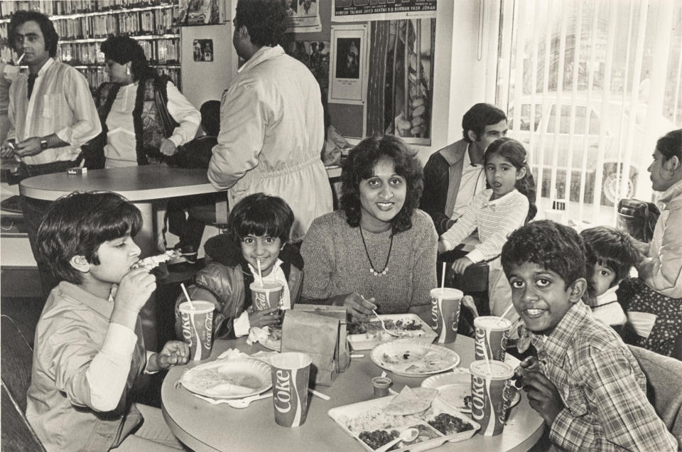 People eating at Food and Flavor on Devon Avenue in Chicago, December 1984. (Mukul Roy / Chicago History Museum)