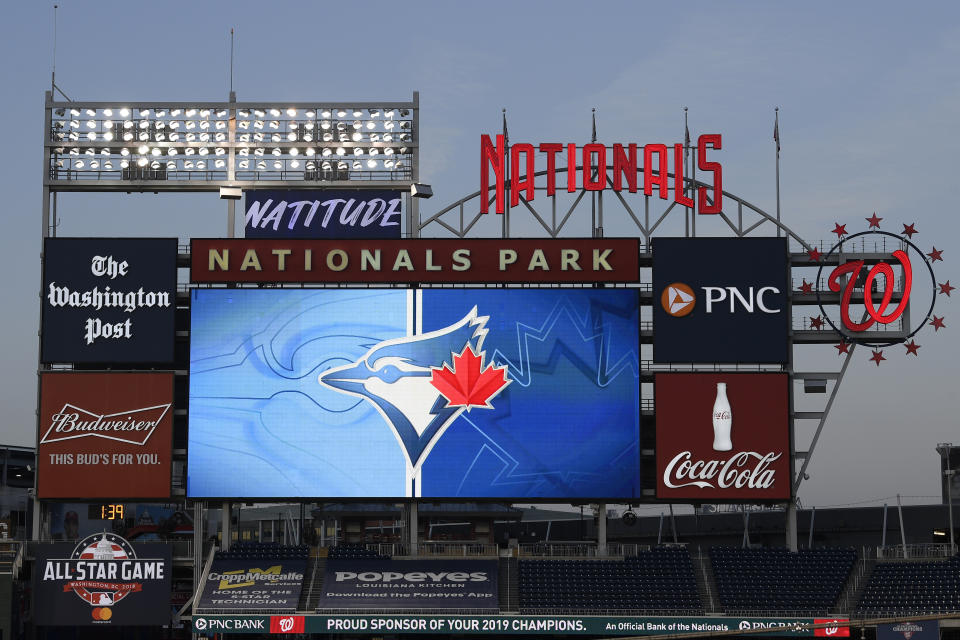 The Toronto Blue Jays' logo is displayed on the scoreboard during the middle of the eighth inning of the team's baseball game against the Washington Nationals, Wednesday, July 29, 2020, in Washington. The Blue Jays are the home team in the game. (AP Photo/Nick Wass)