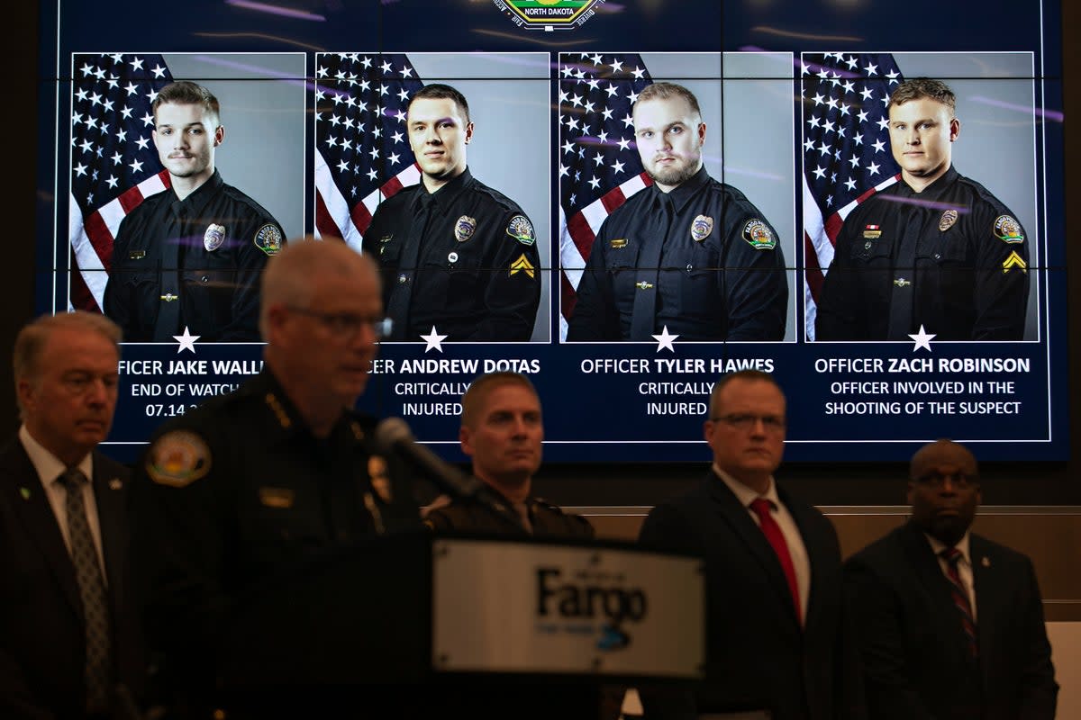 Photos of Fargo, N.D., police officers involved in a shooting are displayed during a news conference (Copyright 2023 The Associated Press. All rights reserved.)