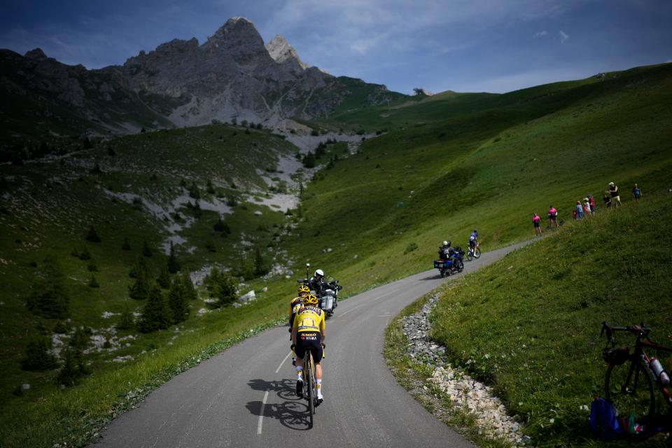 Denmark's Jonas Vingegaard, wearing the overall leader's yellow jersey, follows teammate Netherlands' Wilco Kelderman as they climb Col de la Loze pass during the seventeenth stage of the Tour de France cycling race on Wednesday, July 19, 2023