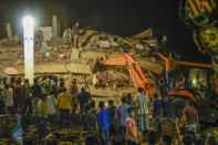 MUMBAI, INDIA - AUGUST 24: Rescue workers search for survivors in the debris after a five-story building collapsed in Mahad of Raigad district in the western state of Maharashtra, India on August 24, 2020. (Photo by Imtiyaz Shaikh/Anadolu Agency via Getty Images)