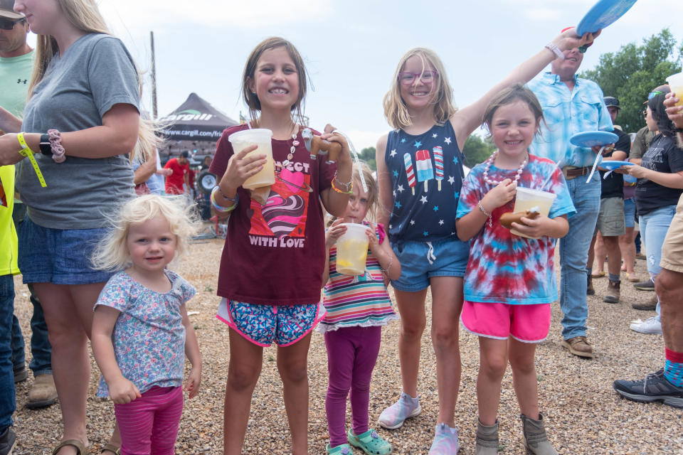 A group of young girls take a refreshment break  Saturday at Friona's 17th annual Cheeseburger Festival.