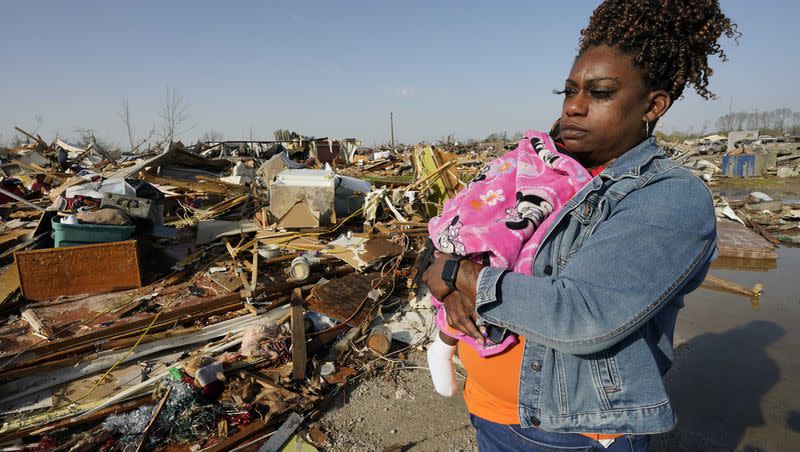 Wonder Bolden cradles her year-old granddaughter Journey Bolden as she surveys the remains of her mother’s tornado-demolished mobile home in Rolling Fork, Miss., Saturday, March 25, 2023. Emergency officials in Mississippi say several people have been killed by tornadoes that tore through the state on Friday night, destroying buildings and knocking out power as severe weather produced hail the size of golf balls moved through several southern states.