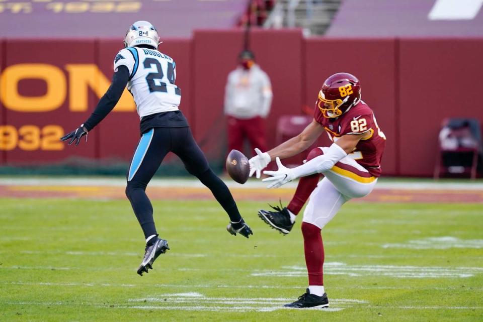 Washington Football Team tight end Logan Thomas (82) drops a pass Sunday as Carolina Panthers cornerback Rasul Douglas (24) covers him. With a chance to win a playoff spot, Washington fell behind 20-0 and lost to Carolina, 20-13.