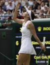 Romania's Simona Halep celebrates defeating United States' Cori "Coco" Gauff in a women's singles match against on day seven of the Wimbledon Tennis Championships in London, Monday, July 8, 2019. (AP Photo/Kirsty Wigglesworth)