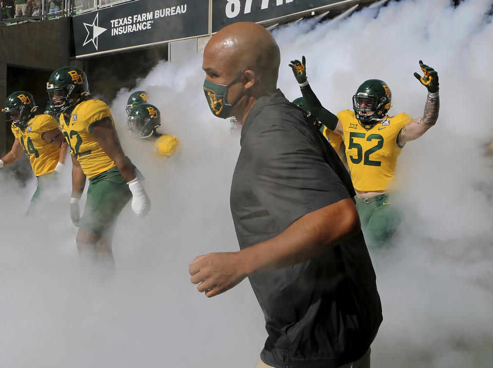 Baylor coach Dave Aranda takes the field with his team before an NCAA college football game against TCU in Waco, Texas, Saturday, Oct. 31, 2020. (Jerry Larson/Waco Tribune-Herald via AP)