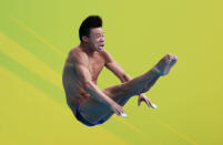 SHANGHAI, CHINA - JULY 18: He Min of the People's Republic of China competes in the Men's 1m Springboard Final during Day Three of the 14th FINA World Championships at the Oriental Sports Center on July 18, 2011 in Shanghai, China. (Photo by Lintao Zhang/Getty Images)