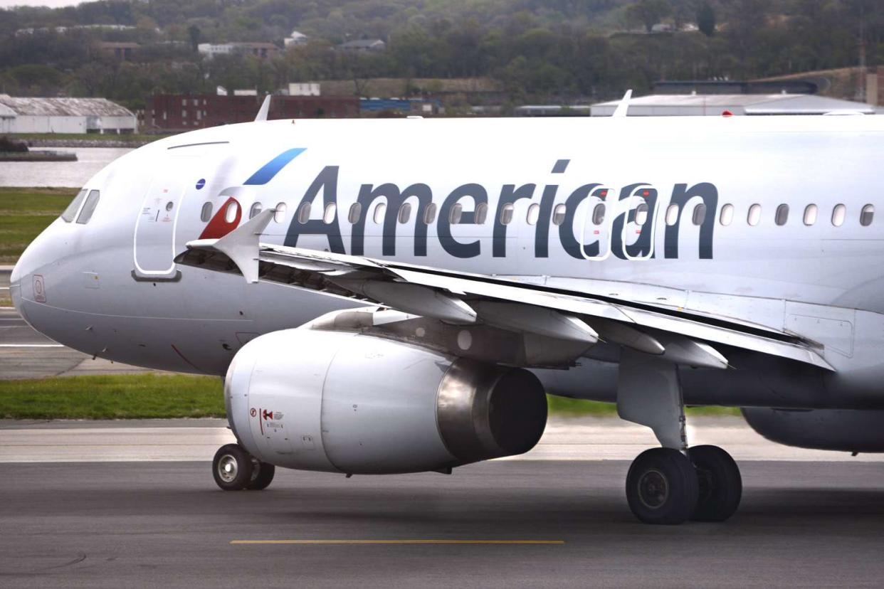 An American Airlines jet taxis to the runway