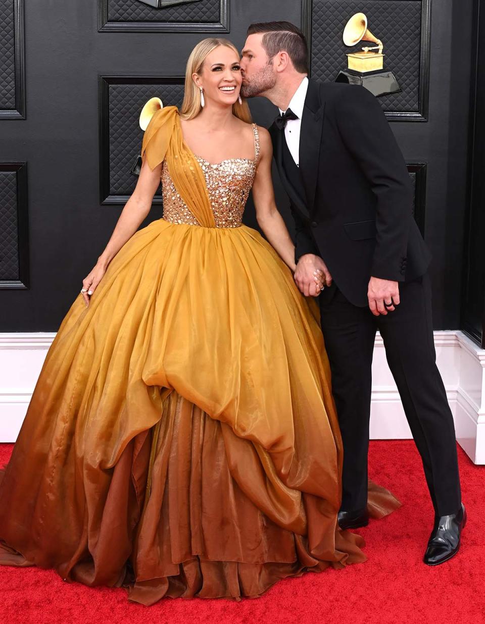 Underwood and Fisher packed on the PDA while attending the Grammy awards.