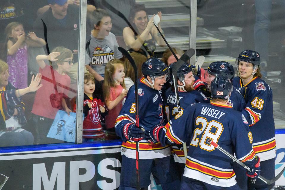 A group of young fans join the Peoria Rivermen as they celebrate a goal by Jordan Ernst (12) in the second period Saturday, April 15, 2023 at Carver Arena. The goal proved to be the game-winner as the Rivermen advanced to the second round of the SPHL playoffs with a 2-1 victory over the Pensacola Ice Flyers.