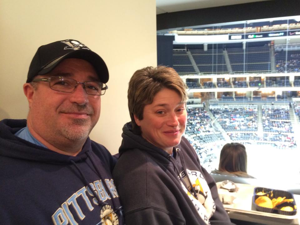 Paul and Heather Oravitz are pictured at one of their son Cole's many hockey games.