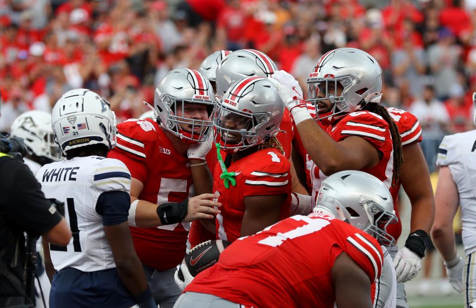 Aug 31, 2024; Columbus, Ohio, USA; Ohio State Buckeyes running back Quinshon Judkins (1) celebrates after scoring a touchdown against the Akron Zips during the second half at Ohio Stadium. Mandatory Credit: Joseph Maiorana-USA TODAY Sports