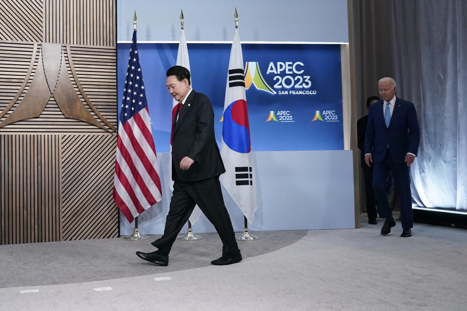 Japan's Prime Minister Kishida Fumio arrives with President Joe Biden and South Korea's President Yoon Suk Yeol for a photo ahead of their meeting on the sidelines of the Asia-Pacific Economic Cooperation summit, Thursday, Nov. 16, 2023, in San Francisco. (AP Photo/Godofredo A. Vásquez)
