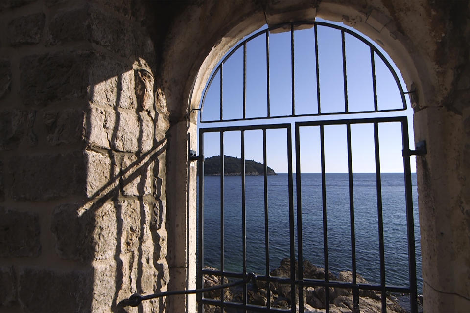 This Tuesday, March 17, 2020 photo shows the door of the Lazarettos complex, called Lazareti in Croatian, in Dubrovnik, Croatia. Just outside the majestic walls of Croatia’s medieval citadel city of Dubrovnik lies a cluster of small stone houses that today serve as an art and clubbing hub. But as the coronavirus spreads across the globe, many are being reminded of the Lazareti complex’s original use as an ancient quarantine area that helped keep infectious diseases away. (AP Photo/Darko Bandic)