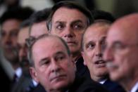 Brazil's President Jair Bolsonaro looks on during the ceremony of the 300 days of Government, in Brasilia