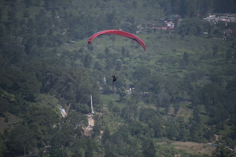 The Asian Games paragliding competition is being held in countryside near Jakarta