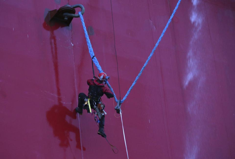 Greenpeace International activist attempts to scale the Gazprom-owned Prirazlomnaya oil platform during a protest in the Pechora Sea