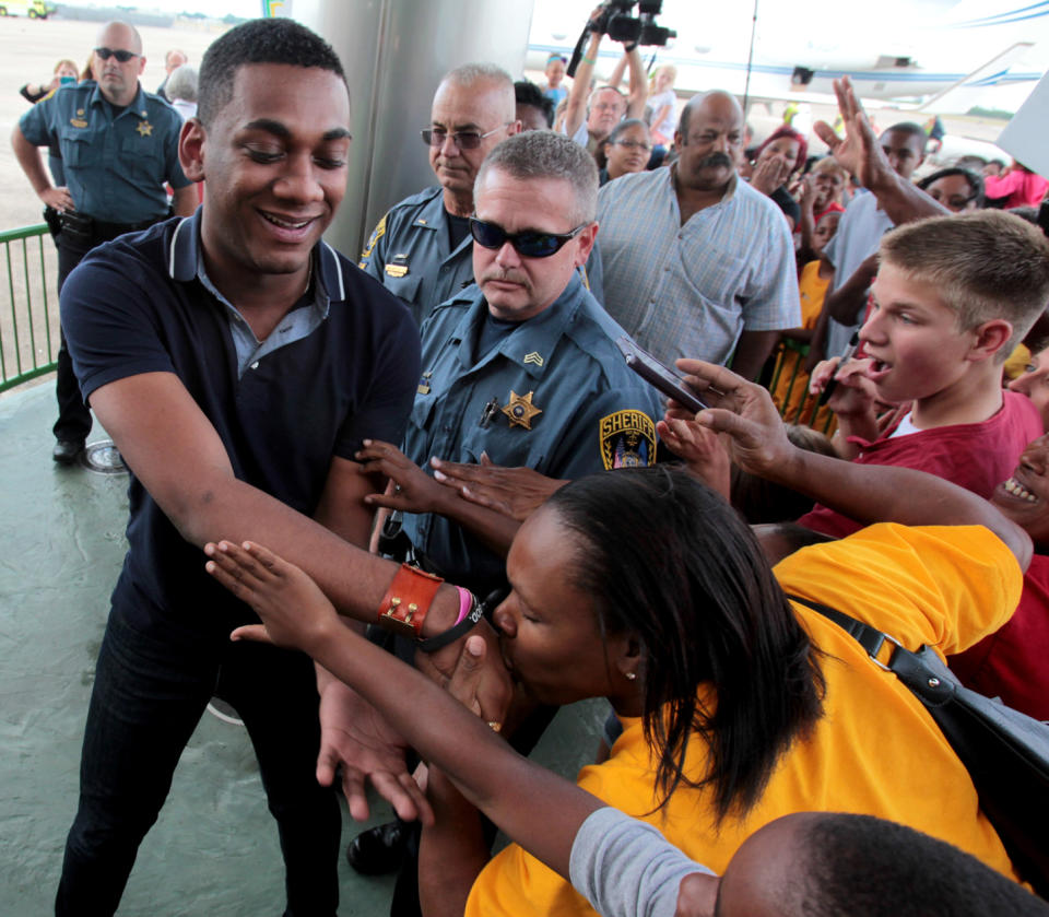 "American Idol" finalist Joshua Ledet of Westlake, La., is greeted by fans after his arrival from Los Angeles at Chennault International Airport in Lake Charles on Friday, May 11, 2012. Ledet, the 20-year-old top-three finalist on Fox's TV singing competition will be honored with a parade in his home town on Saturday, May 12, 2012, and a pep rally in Burton Coliseum in Lake Charles that evening. (AP Photo/K Wink, LAKE CHARLES AMERICAN PRESS)