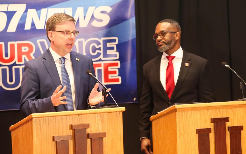 Common Council member Henry Davis Jr., at right, who is seeking the Democratic nomination for South Bend mayor, listens as Mayor James Mueller answers a question Wednesday, March 15, 2023, at the Democratic South Bend mayoral debate at Indiana University South Bend.