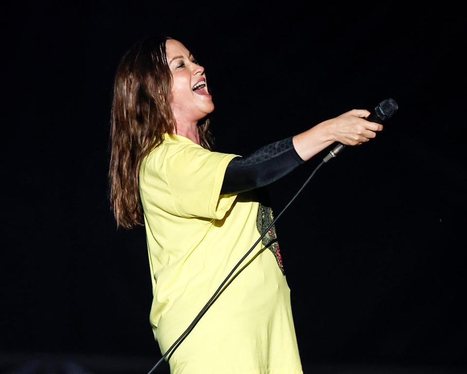 Alanis Morissette calls for the crowd to sing during her concert at the Iowa State Fair Grandstand on Monday, Aug. 15, 2022, in Des Moines.
