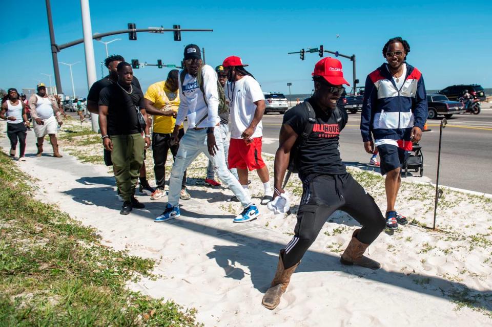 Johnny Morgan dances on the sidewalk during Black Spring Break in Biloxi on Saturday, April 9, 2022.