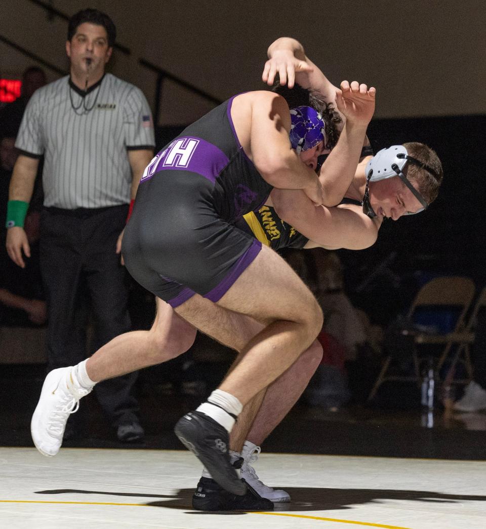 St. John Vianney's Cole Stangle (left) defeated Rumson-Fair Haven's Luke Dougherty by major decision in the 175-pound bout of the Lancers' 44-26 win Wednesday night.