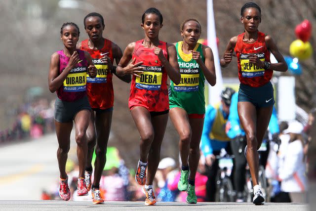 <p>John Blanding/The Boston Globe/Getty</p> (L-R) Mare Dibaba, Jemima Jelagat Sumgong, Buzunesh Deba, Meselech Melkamu, and Rita Jeptoo during the 118th Boston Marathon on Monday, April 21, 2014.