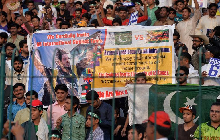 Pakistani spectators await the start of the sell-out international T20 match between Pakistan and Zimbabwe at the Gaddafi stadium in Lahore on May 22, 2015
