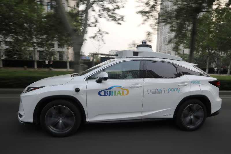 FILE PHOTO: A Lexus vehicle equipped with Pony.ai's autonomous driving system drives on a road during a test in Beijing