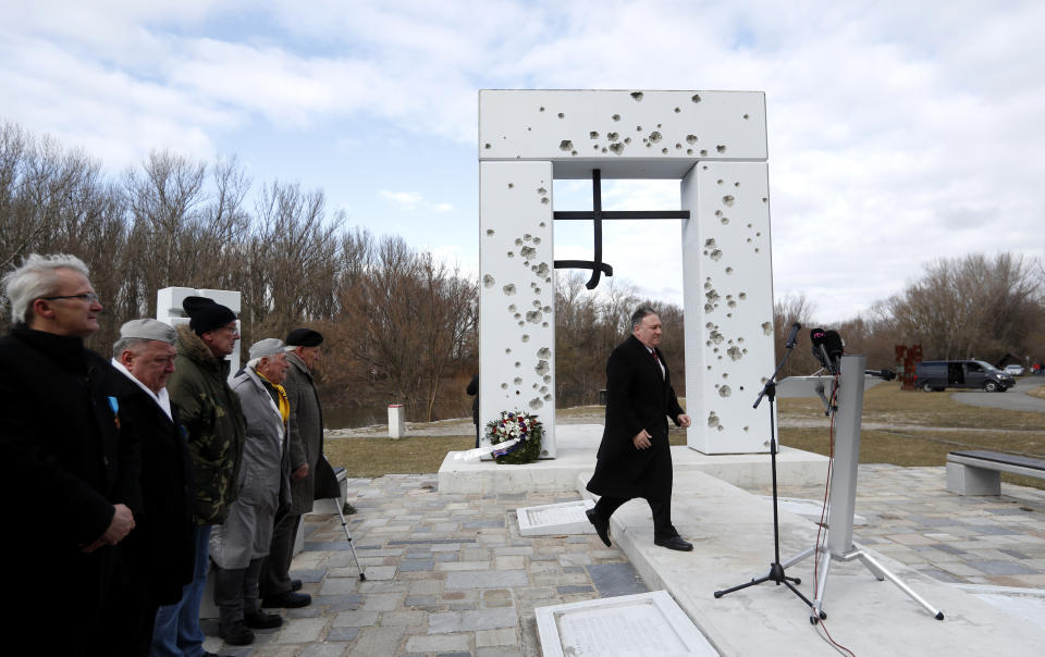 US Secretary of State Mike Pompeo arrives at the Freedom Gate memorial in Bratislava, Slovakia, Tuesday, Feb. 12, 2019. Pompeo on Tuesday invoked the 30th anniversary of the demise of communism to implore countries in Central Europe to resist Chinese and Russian influence. (AP Photo/Petr David Josek)