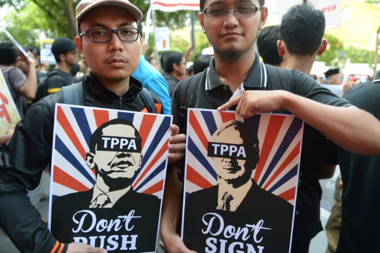 Malaysians protest the Trans-Pacific Partnership free-trade agreement as the 27th Association of Southeast Asian Nations (ASEAN) Summit takes place in Kuala Lumpur on November 21, 2015