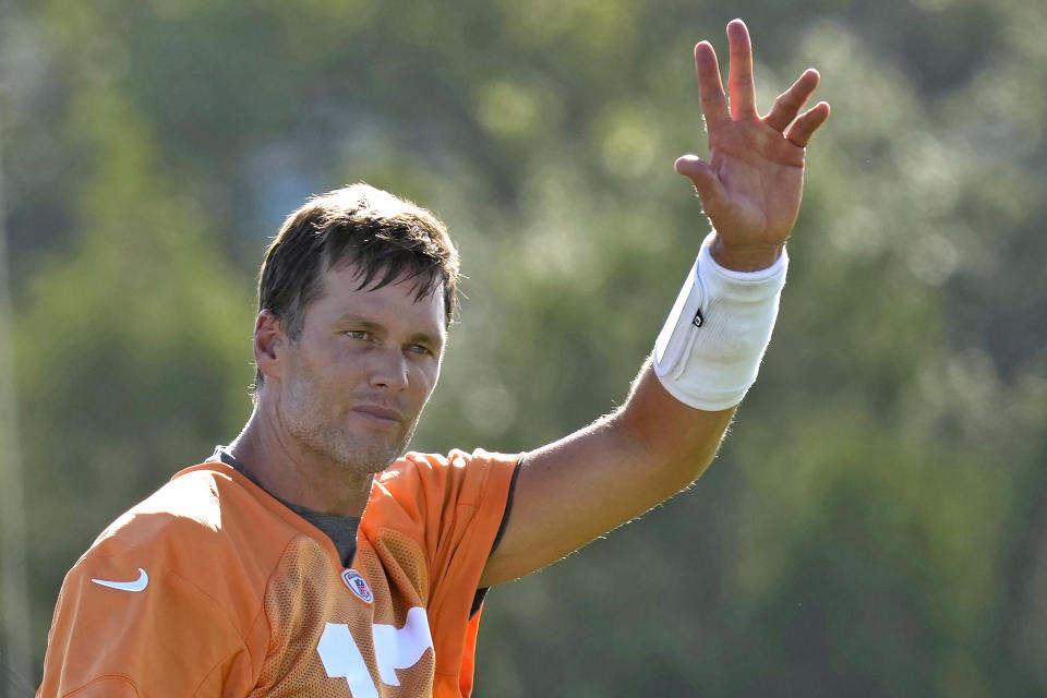 FILE - Tampa Bay Buccaneers quarterback Tom Brady waves to the fans during an NFL football training camp practice Wednesday, July 27, 2022, in Tampa, Fla. Indianapolis Colts quarterback Matt Ryan expects to see his most extensive preseason action against a familiar foe. Tampa Bay quarterback Tom Brady is scheduled to make his preseason debut on a familiar field. Yes, the two guys who finished the 2016 season by starting in the Super Bowl are are expected to square off again in Saturday's preseason finale. (AP Photo/Chris O'Meara, File)