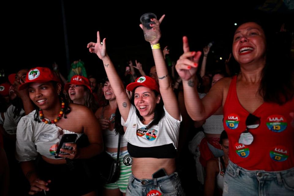 Supporters of Brazilian former President and candidate for the leftist Workers Party Luiz Inacio Lula da Silva celebrate while watching the vote count of the presidential run-off election at Largo Sao Francisco da Prainha in Rio de Janeiro, Brazil, on Oct. 30, 2022.<span class="copyright">Mauro Pimental—AFP/Getty Images</span>