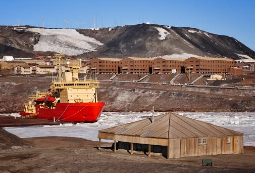 The men were found at McMurdo Station, located behind the famous Discovery Hut (foreground) on Ross Island. Source: Getty