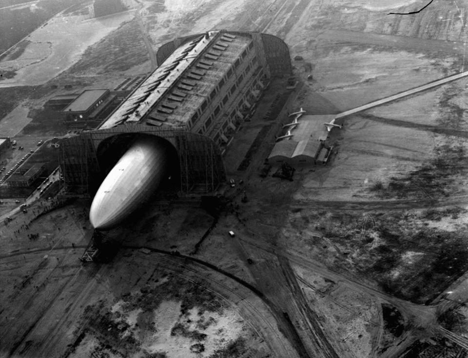 <p>The German zeppelin Hindenburg, its nose hooked to a mooring mast, is guided into a U.S. Navy dirigible hangar in Lakehurst, NJ, May 9, 1936, after the first leg of 10 scheduled round trips between Germany and the U.S. (AP Photo/Joe Caneva) </p>