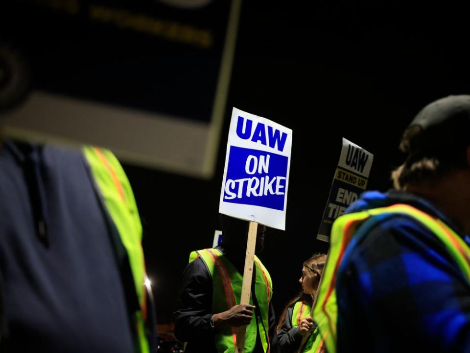  Factory workers and UAW union members form a picket line outside the Ford Motor Co. Kentucky Truck Plant in the early morning hours on Oct. 12.