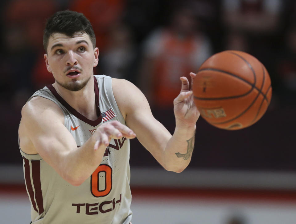 FILE - Virginia Tech's Hunter Cattoor (0) passes the ball during the second half against Georgia Tech in an NCAA college basketball game Feb. 2, 2022, in Blacksburg, Va. Cattoor was the team's third-leading scorer and made 83 3-pointers last season when the Hokies finished 23-13. (Matt Gentry/The Roanoke Times via AP, File)