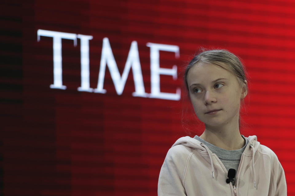 Swedish environmental activist Greta Thunberg takes her seat prior to the opening session of the World Economic Forum in Davos, Switzerland, Tuesday, Jan. 21, 2020. The 50th annual meeting of the forum will take place in Davos from Jan. 20 until Jan. 24, 2020. (AP Photo/Markus Schreiber)