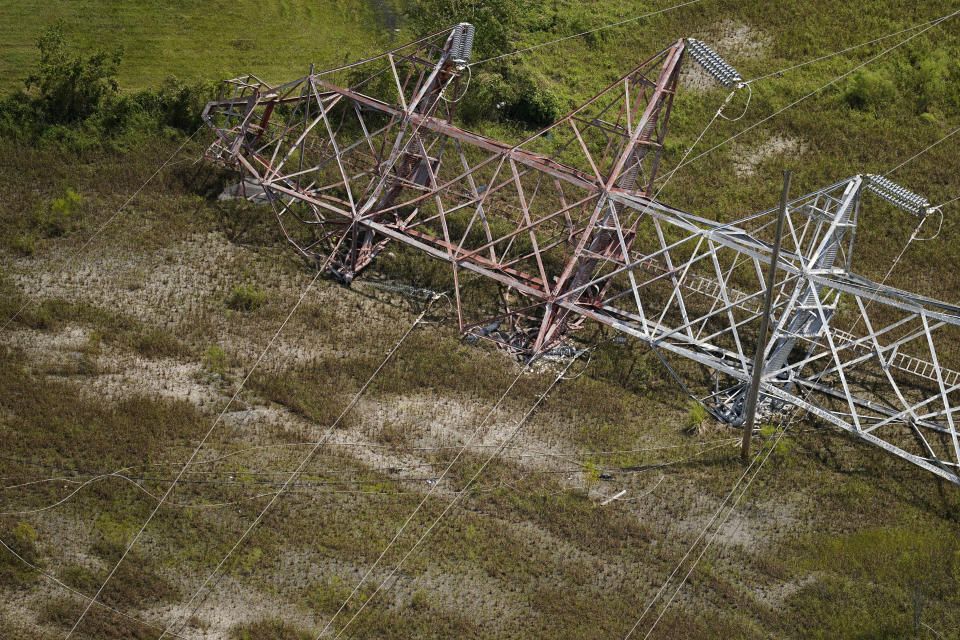 A twisted tower that carried crucial electrical feeder lines to the New Orleans metro area lies collapsed in the aftermath of Hurricane Ida in Bridge City, La., Wednesday, Sept. 1, 2021. Power out, high voltage lines on the ground, maybe weeks until electricity is restored in some places _ it's a distressingly familiar situation for Entergy Corp., Louisiana's largest electrical utility. Entergy is hardly alone. (AP Photo/Gerald Herbert)