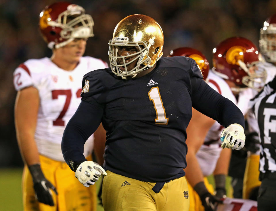 SOUTH BEND, IN - OCTOBER 19: Louis Nix III #1 of the Notre Dame Fighting Irish celebrates near the end of the game against the University of Southern California Trojans at Notre Dame Stadium on October 19, 2013 in South Bend, Indiana. Notre Dame defeated USC 14-10. (Photo by Jonathan Daniel/Getty Images)