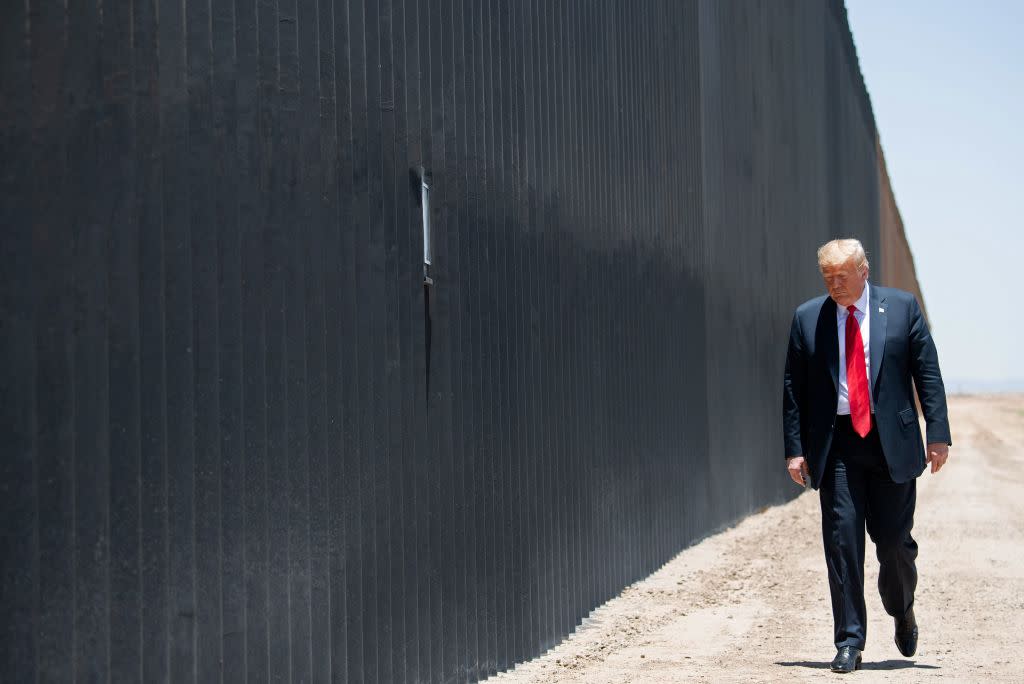  Donald Trump participates in a ceremony commemorating the 200th mile of border wall at the international border with Mexico in San Luis, Arizona,. 