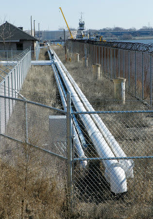 Several pipelines connecting the Eco Energy storage and transfer facilities, not seen in this view, lead to a marine loading dock on the Delaware River where a barge is loading, photographed in Philadelphia, Pennsylvania, U.S. on February 4, 2017. Picture taken February 4, 2017. REUTERS/Tom Mihalek